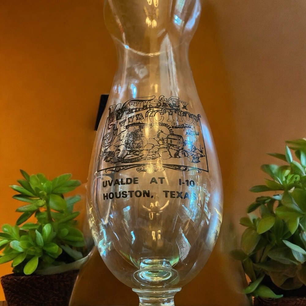Large hurricane glass from Whiskey Junction in Houston TX.